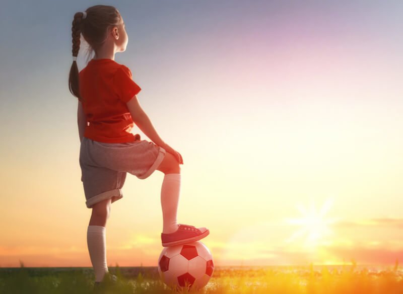 Young girl with football